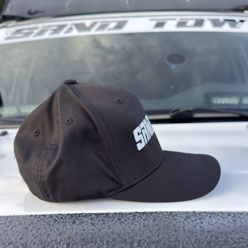 Black cap with a logo on a car roof