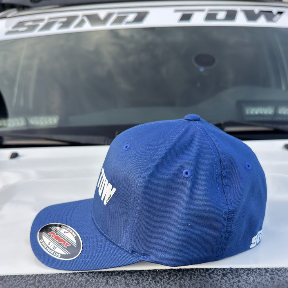 Blue cap with a logo on a car's open sunroof